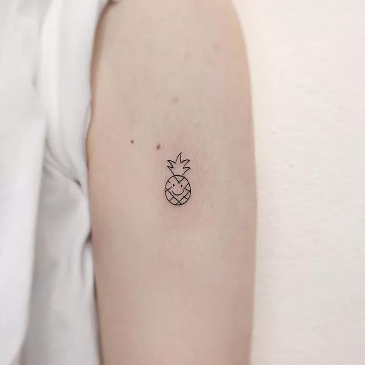 minimalist pineaple arm tattoo
