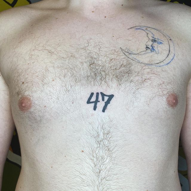 number 47 chest tattoo