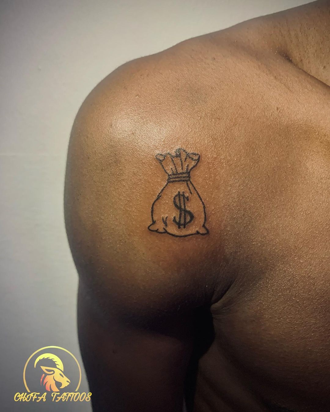 What's the meaning behind a money tattoo ? 