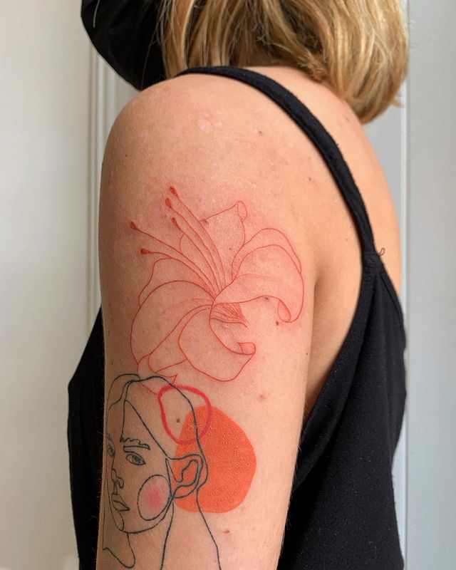 orange arm tattoo