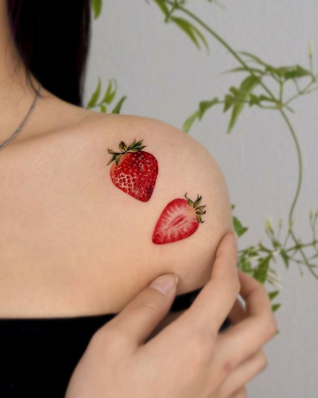 strawberry shoulder tattoo