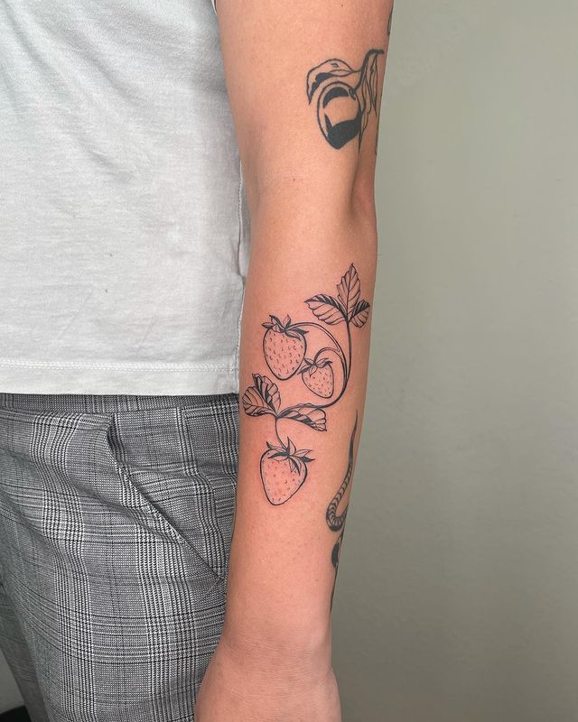 strawberry arm tattoo