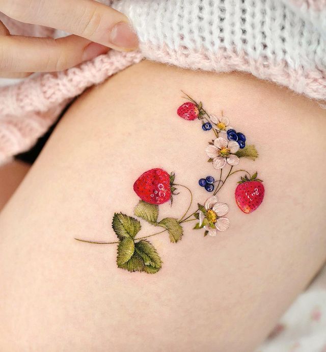 strawberry leg tattoo
