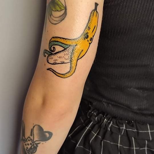 banana arm tattoo