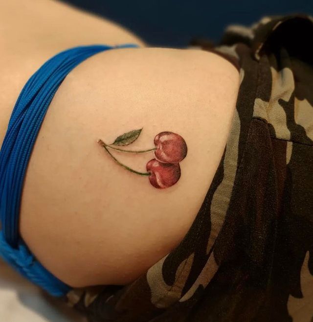 sensual hip cherry tattoo