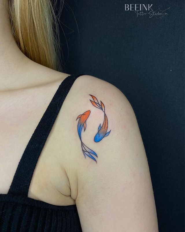 Orange-blue ying yang koi fish tattoo