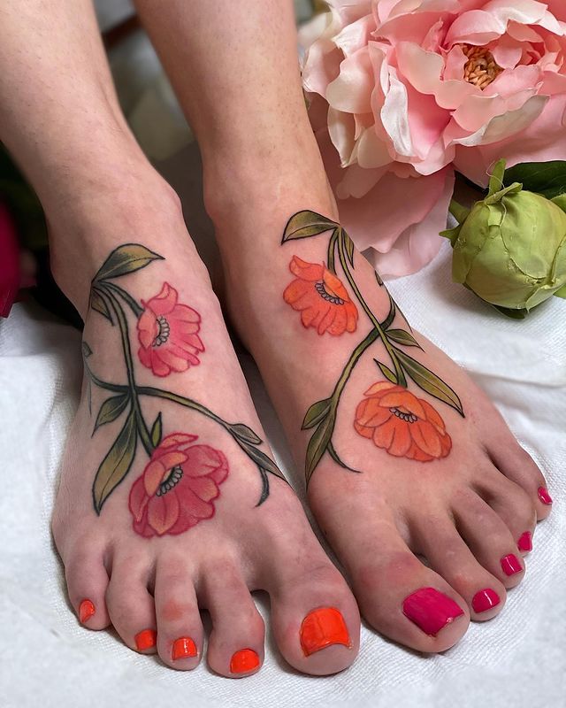 orange flower foot tattoo