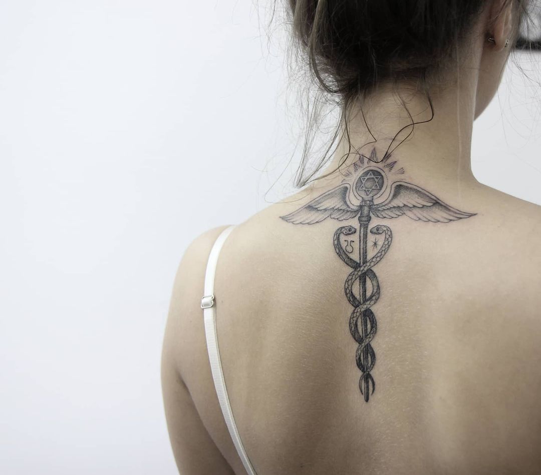 Caduceus tattoo meaning and symbolism 