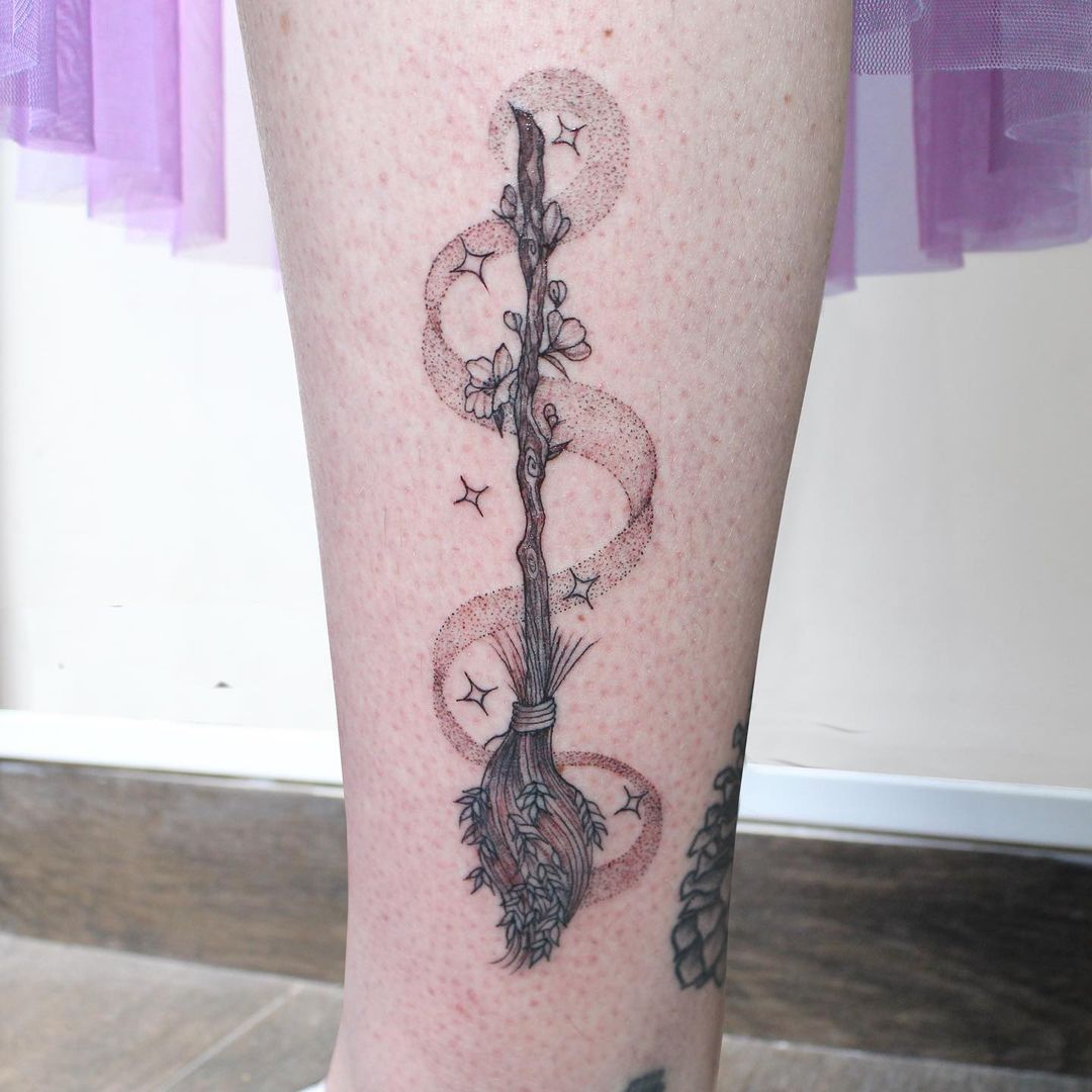 Broomstick leg tattoo