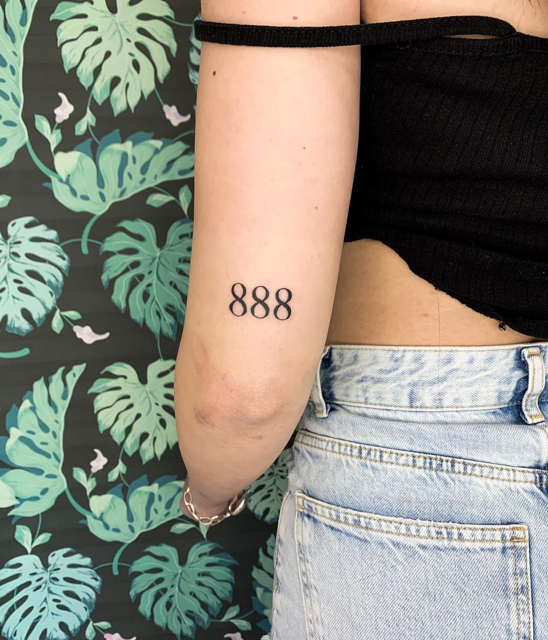 888 arm tattoo
