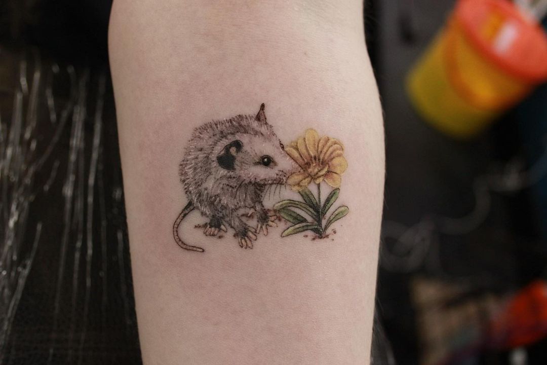 Opossum arm tattoo