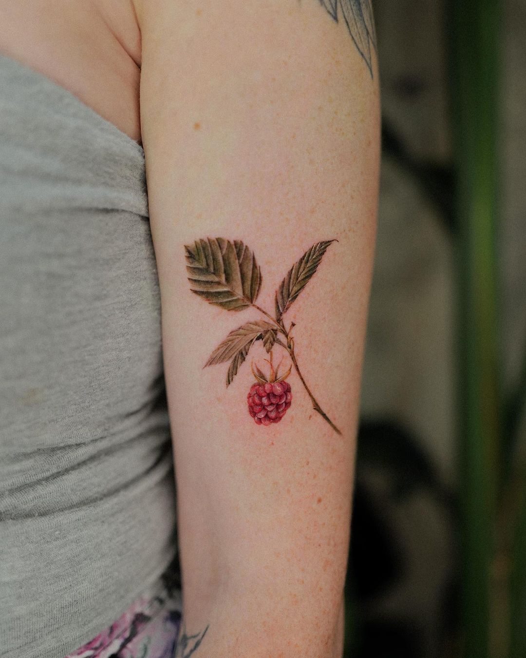 Raspberry arm tattoo
