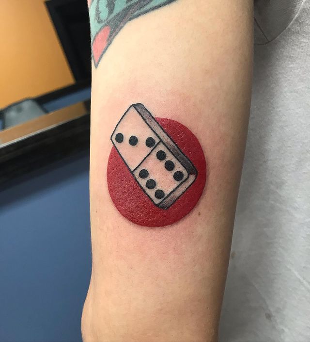 domino on red circle tattoo