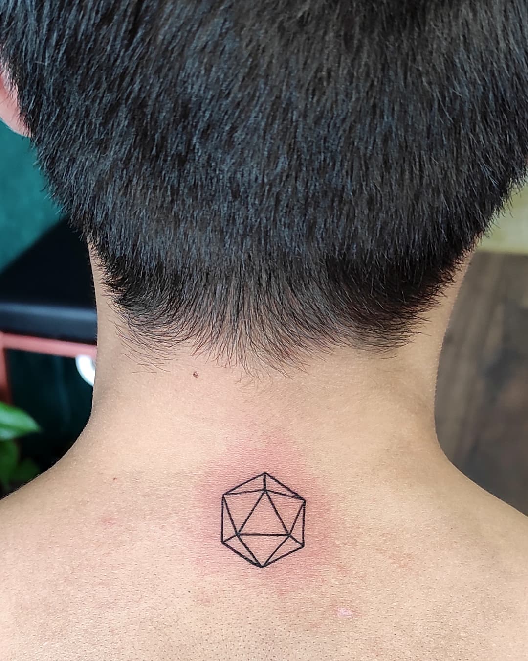 Icosahedron tattoo behind the neck
