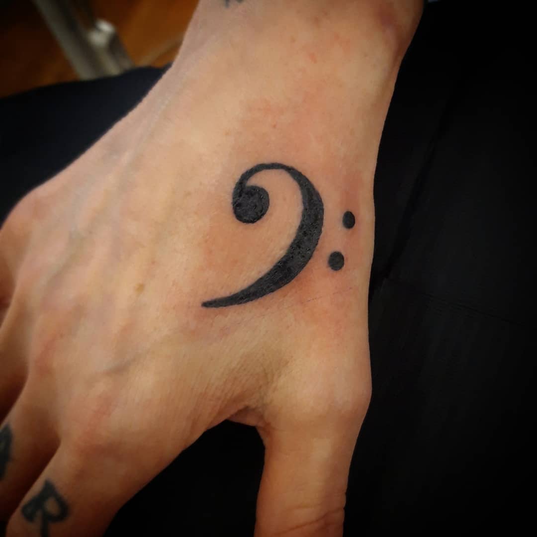 Paisley bass clef tattoo | Music tattoo designs, Small music tattoos,  Guitar tattoo