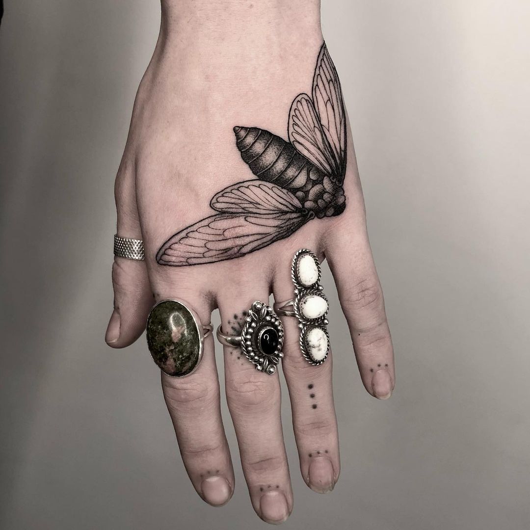 Cicada hand tattoo