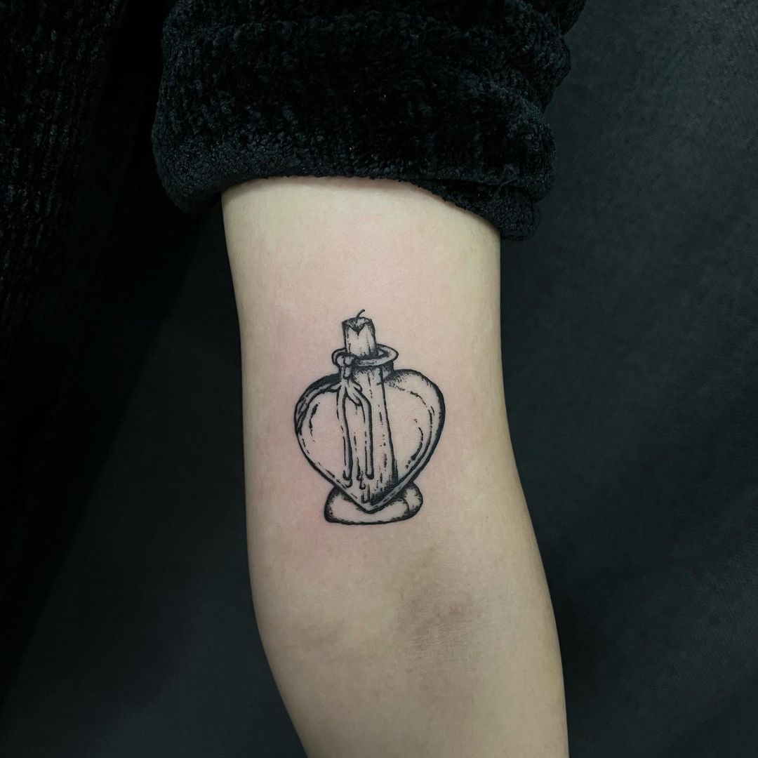 candle arm tattoo