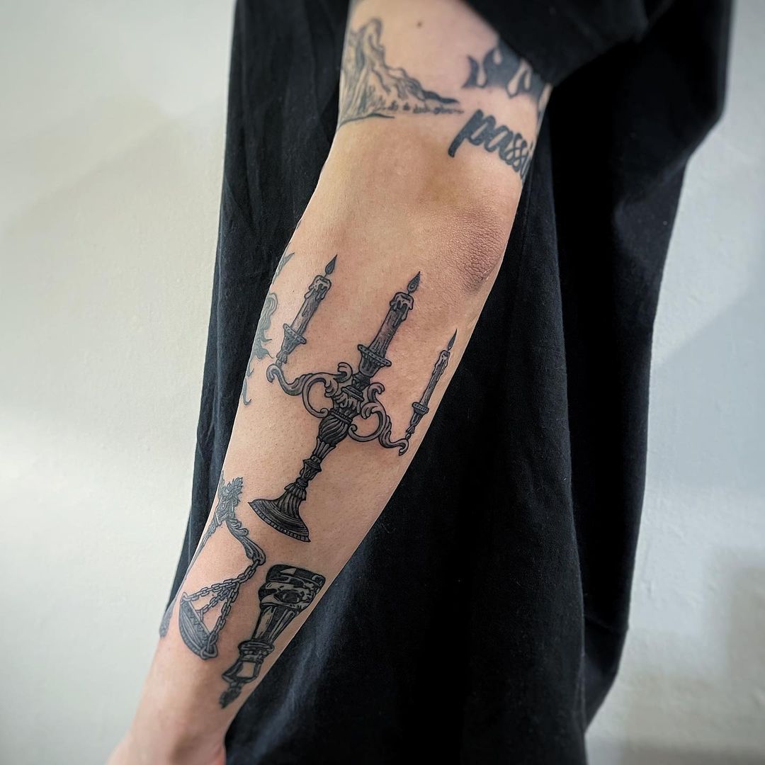 Candle arm tattoo
