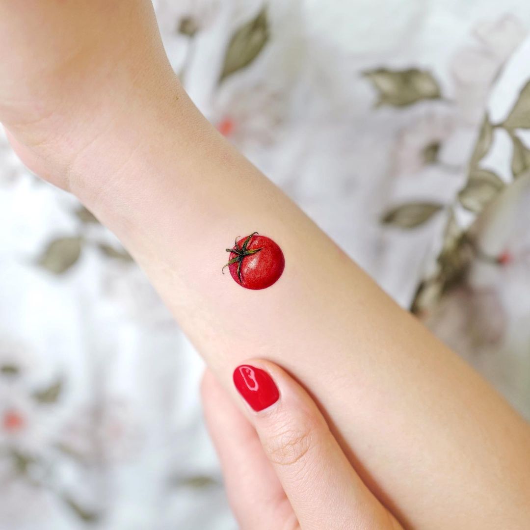 Tomato arm tattoo
