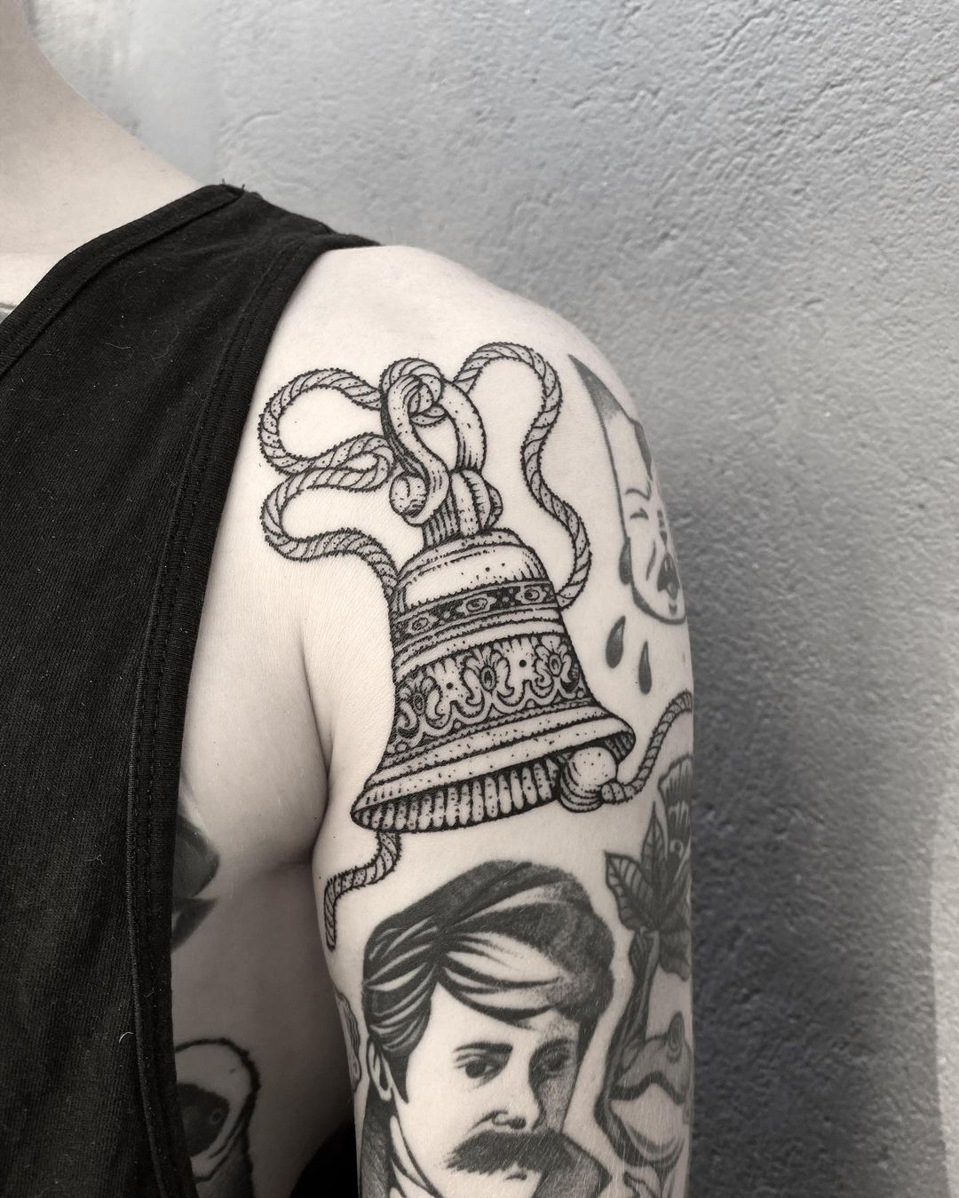 Bell shoulder tattoo