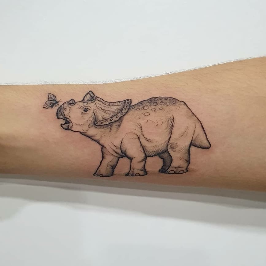Triceratops arm tattoo