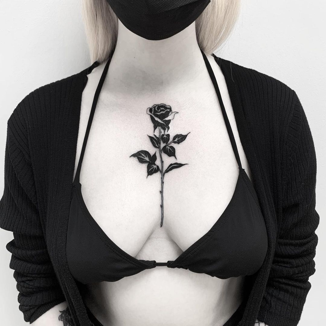black rose chest tattoo