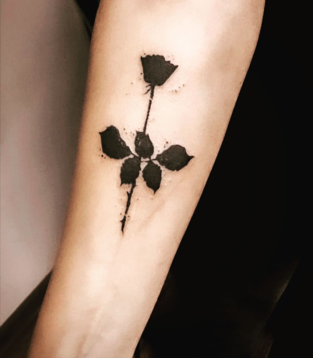 Black rose arm tattoo