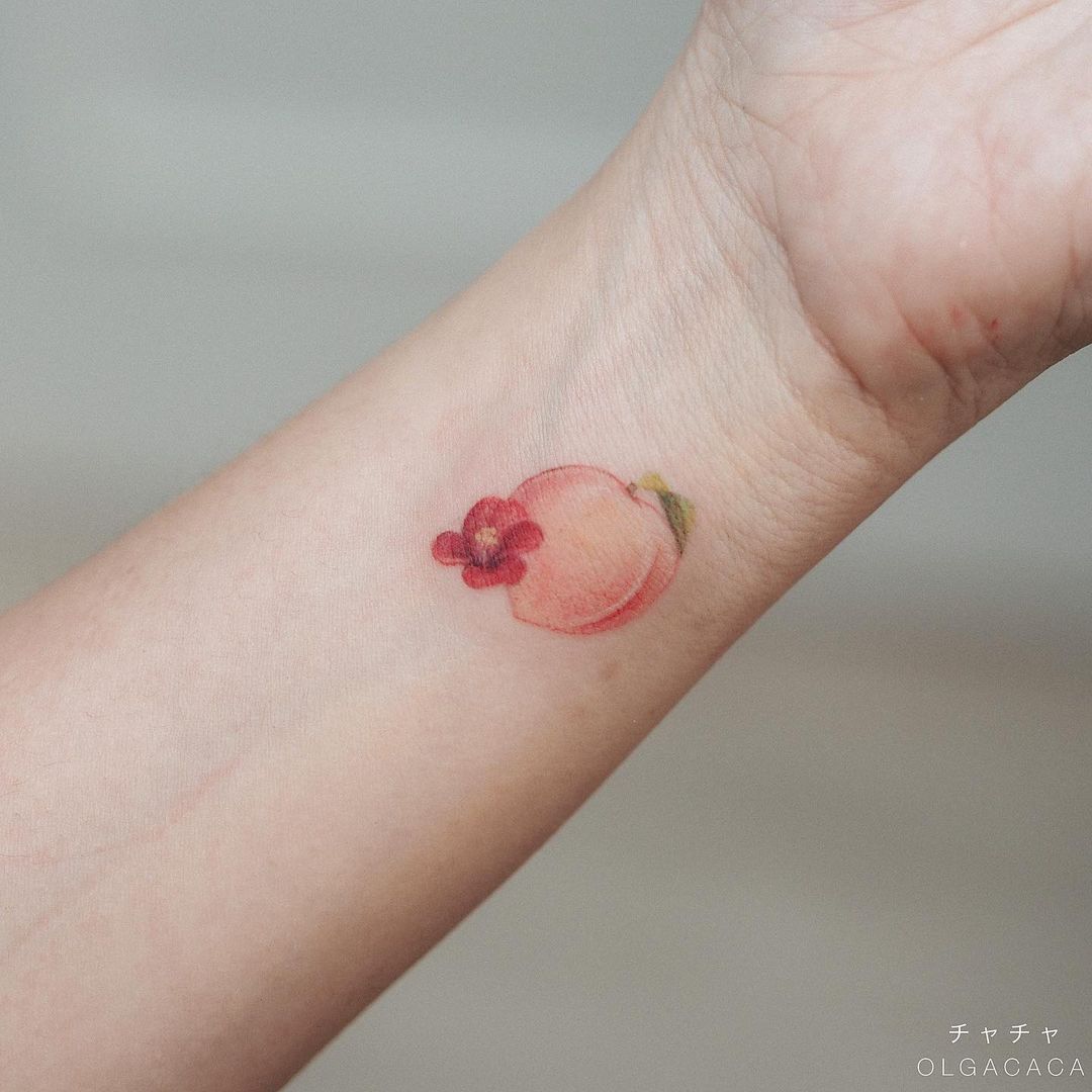peach arm tattoo