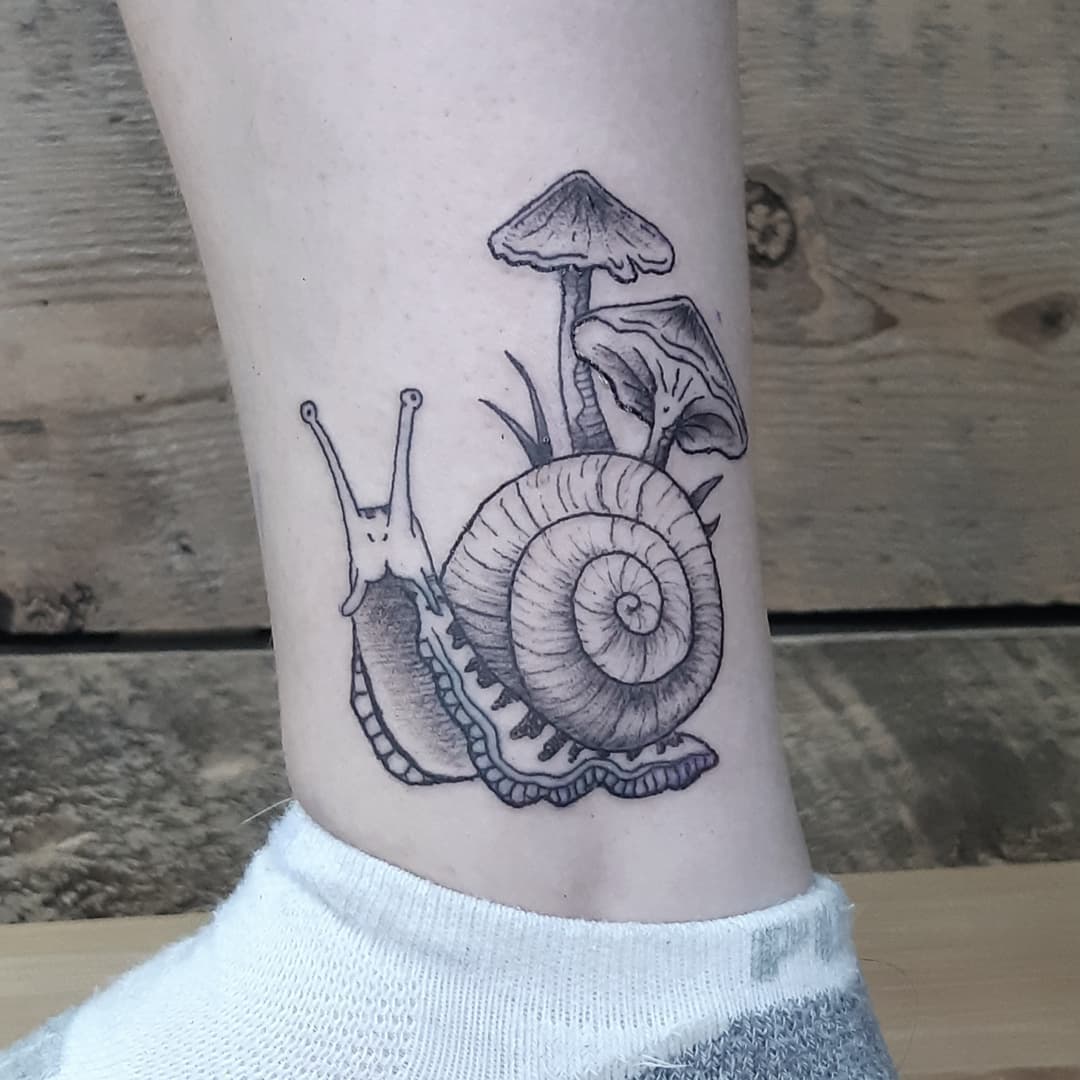 snail ankle tattoo