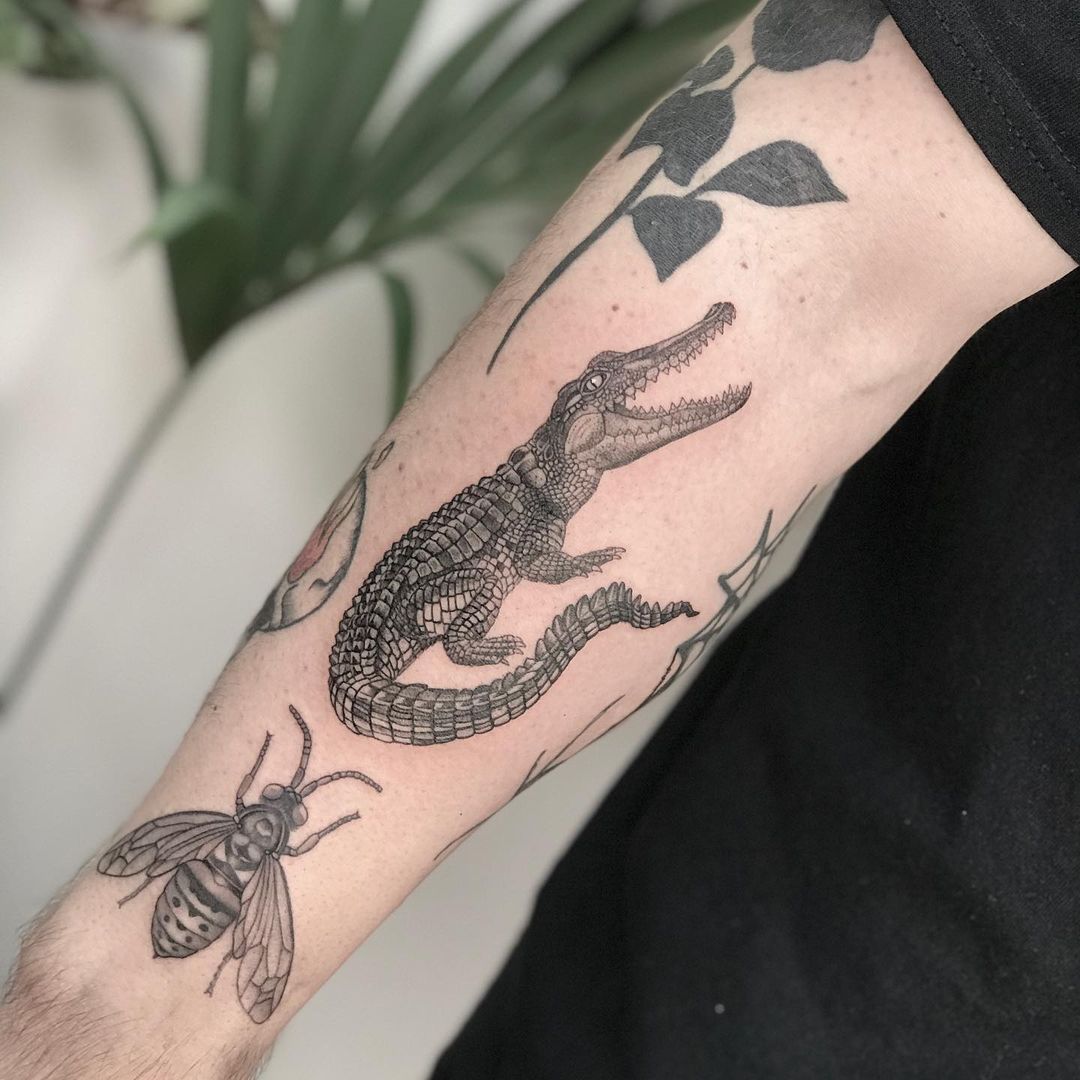 crocodile arm tattoo
