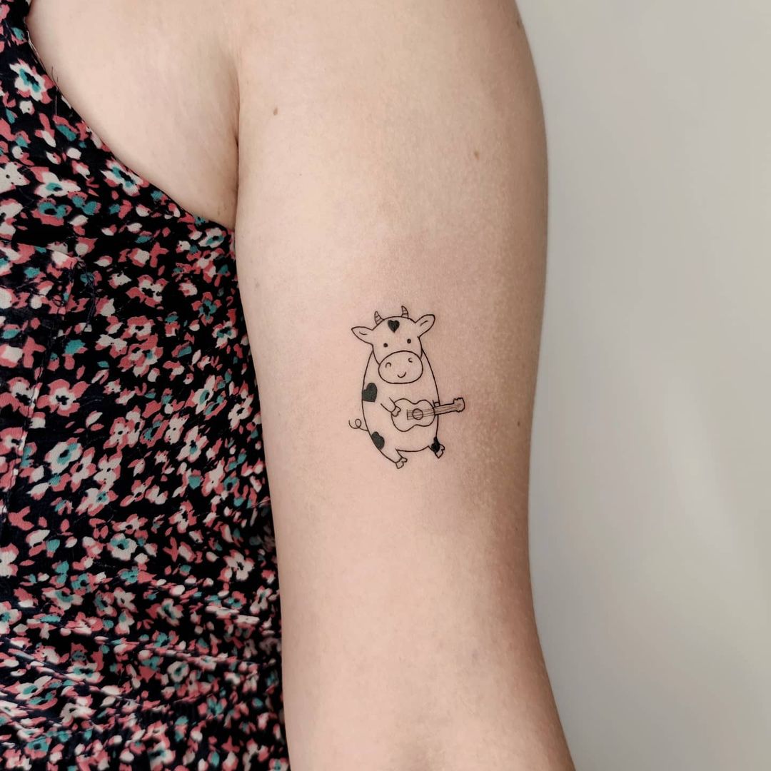 cow arm tattoo