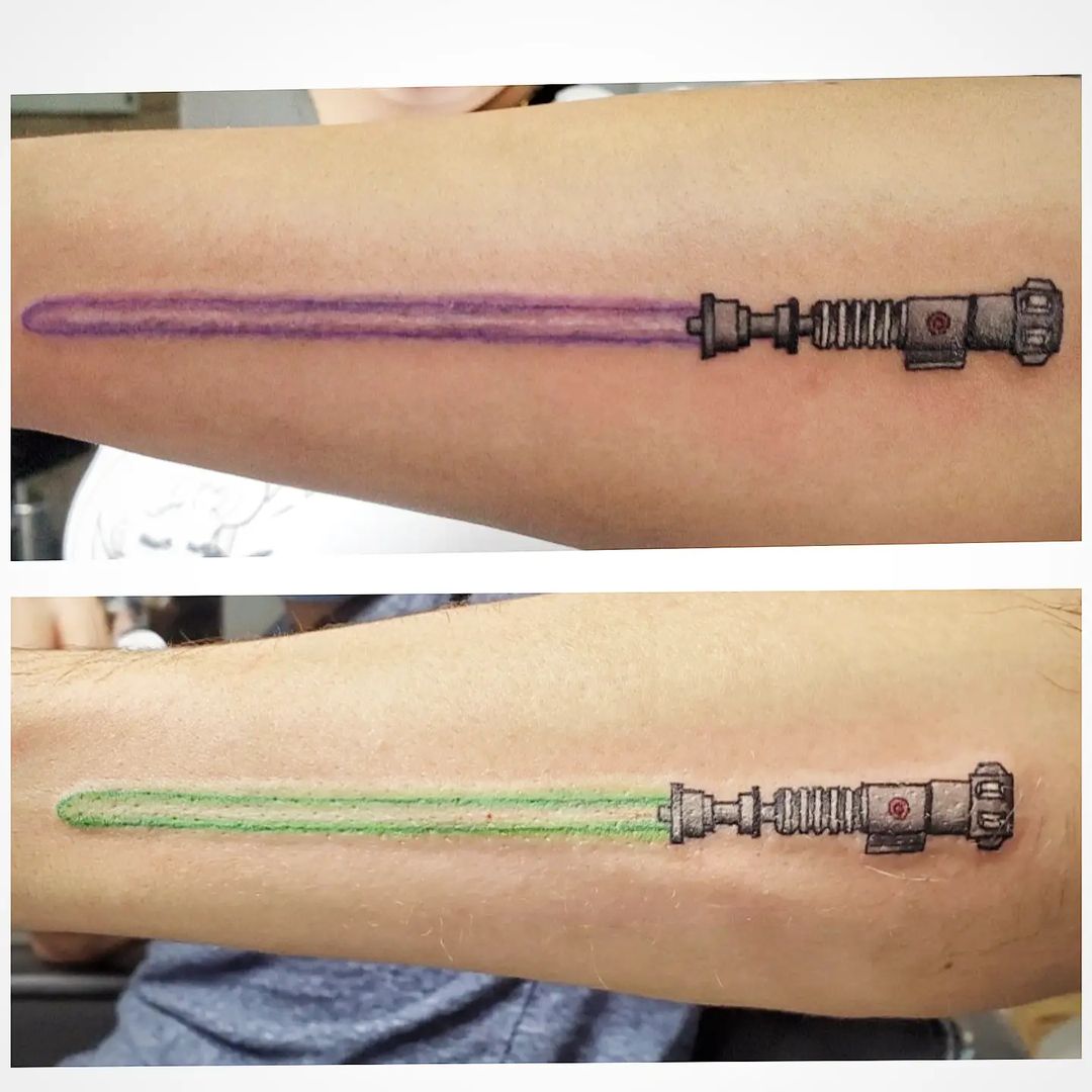 Lightsaber arm tattoos