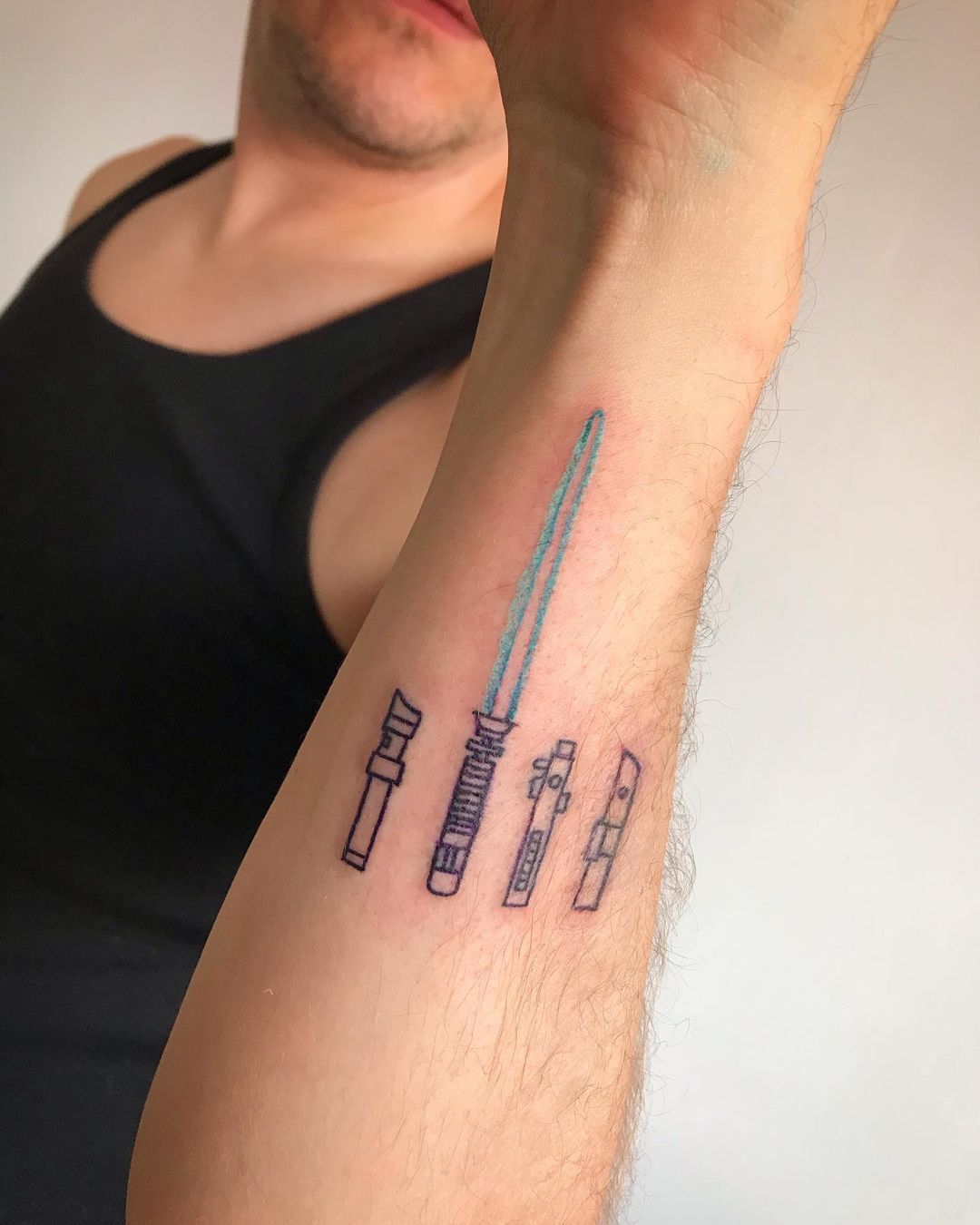Lightsaber arm tattoo