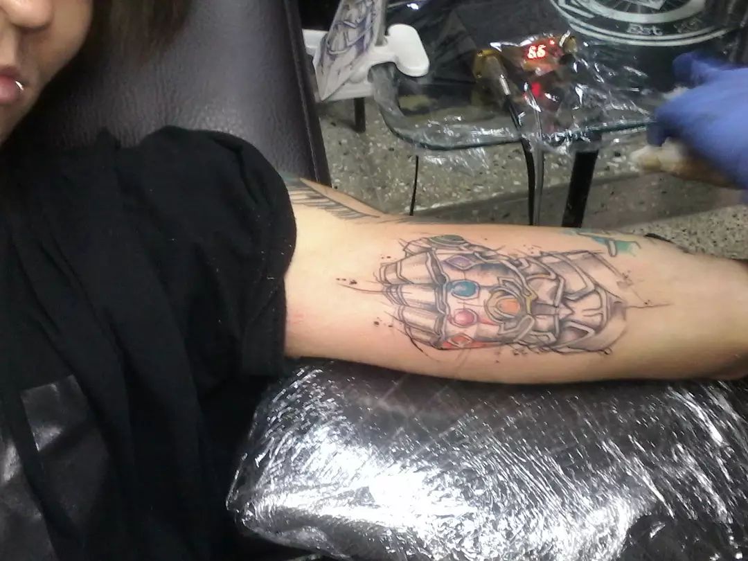 Infinity Gauntlet arm tattoo