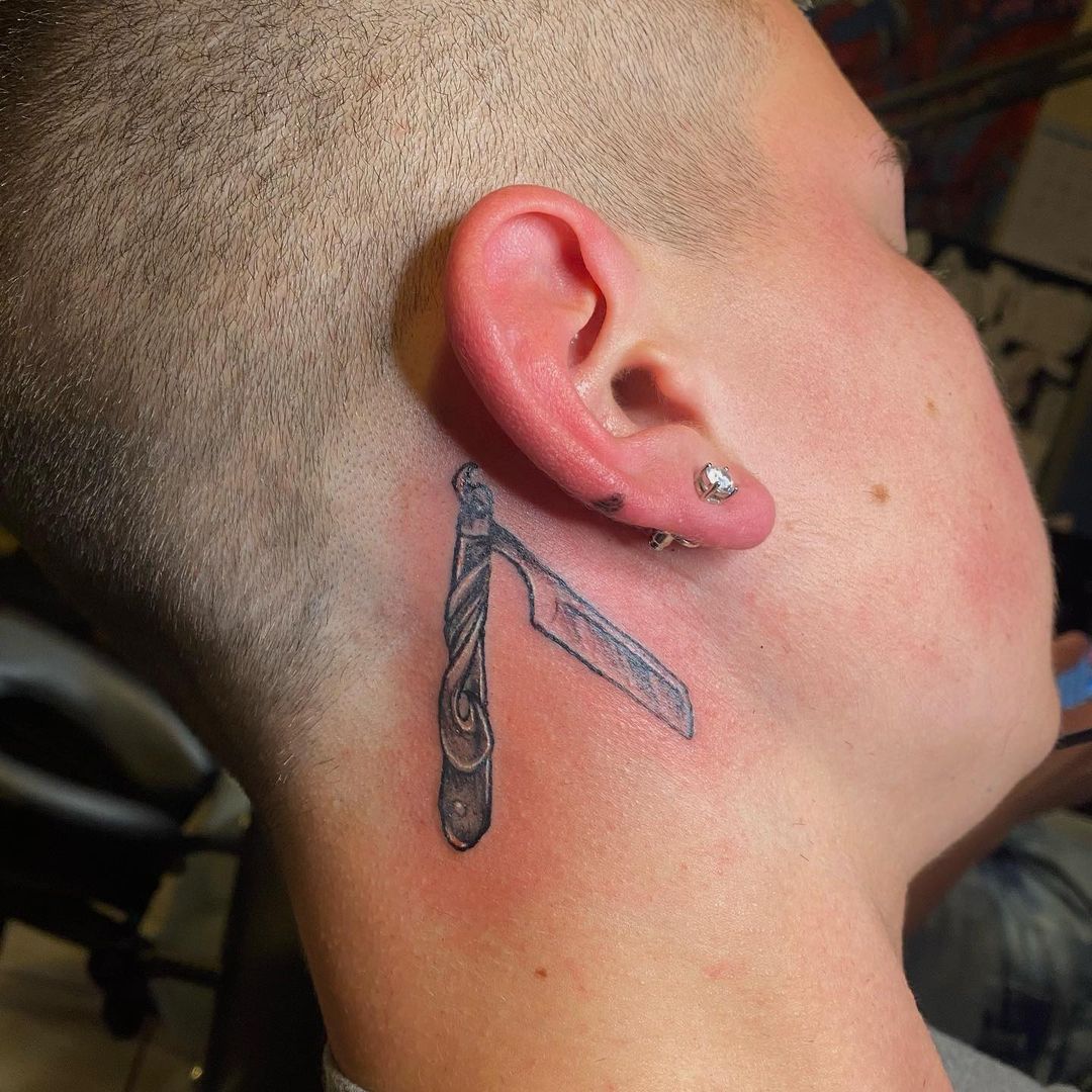 Razor behind the ear tattoo