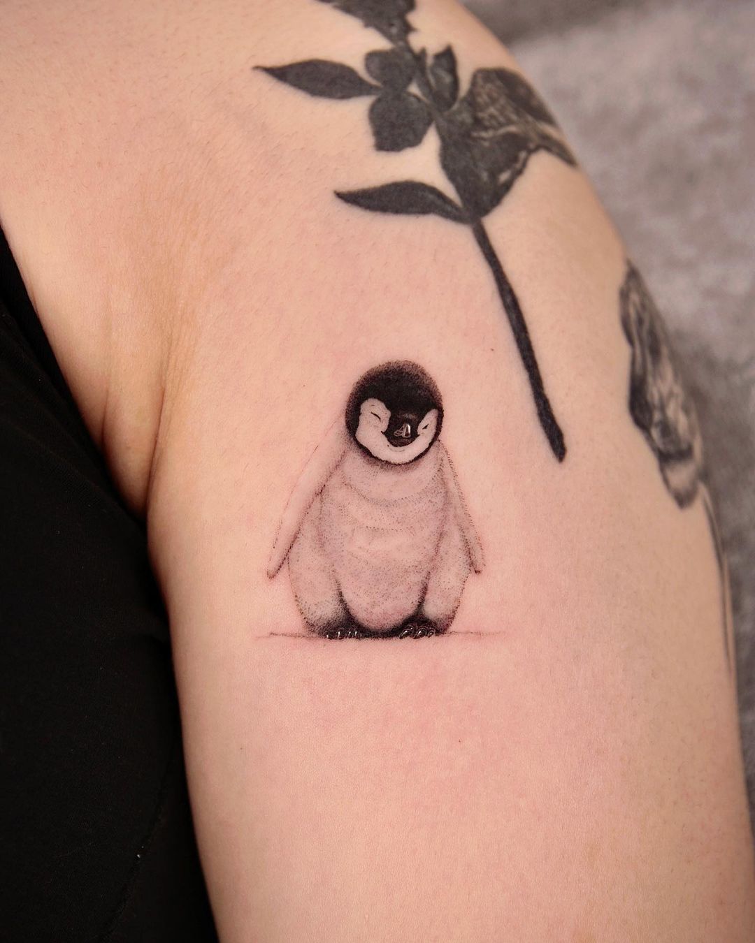 Cute penguin arm tattoo