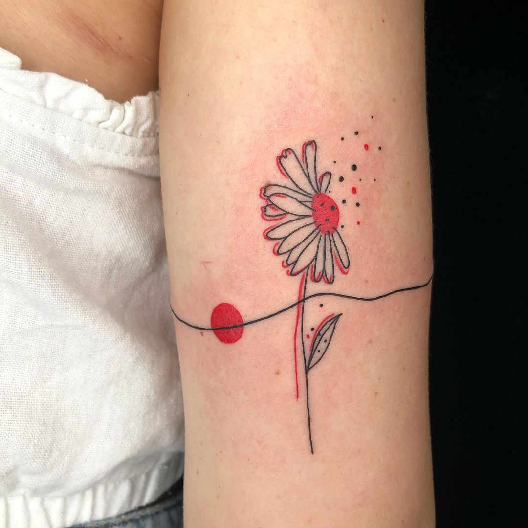 camomile flower arm tattoo