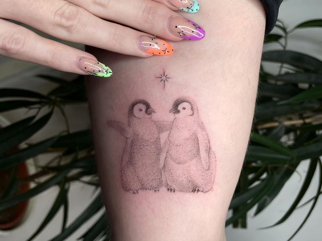 penguin arm tattoo