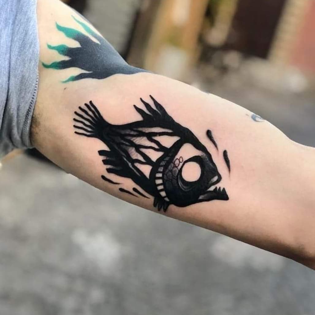 piranha arm tattoo