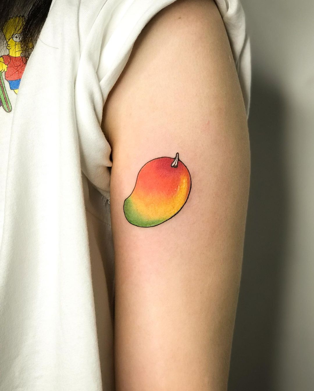 Mango arm tattoo