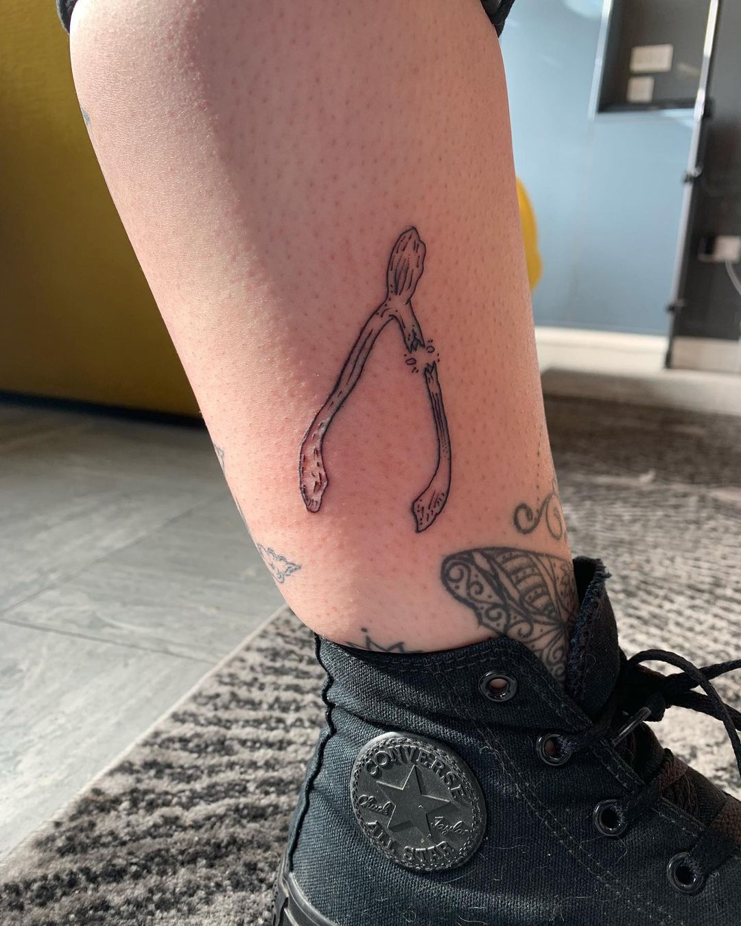 Wishbone leg tattoo