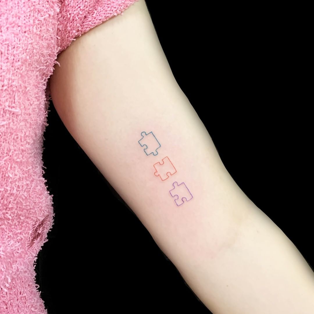 puzzle arm tattoo