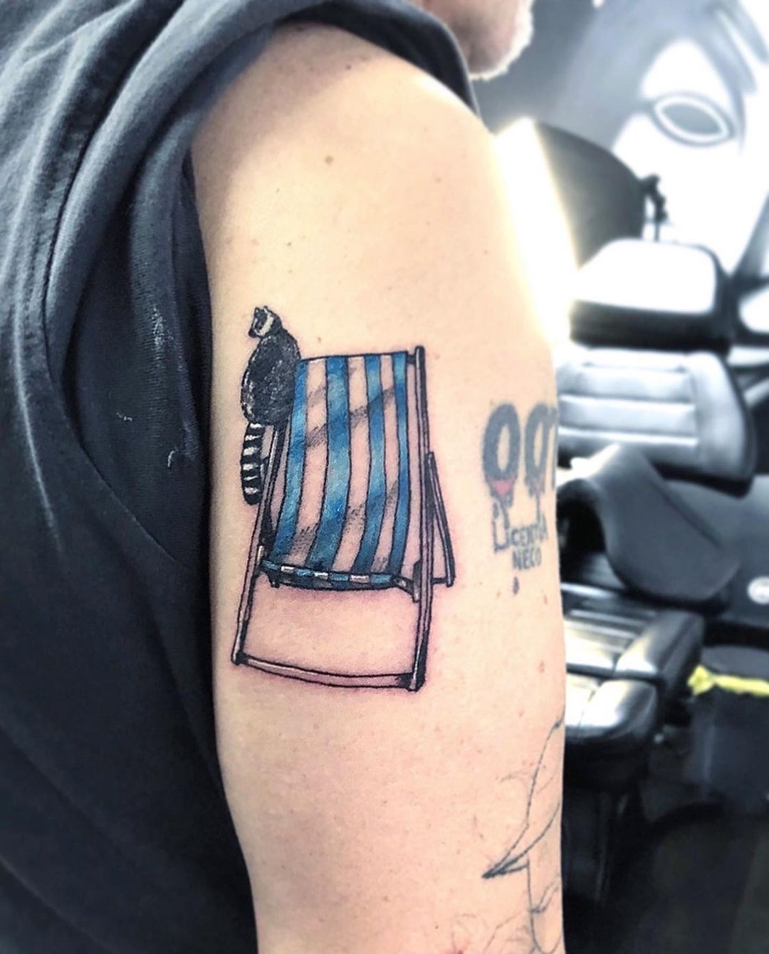 Chair arm tattoo