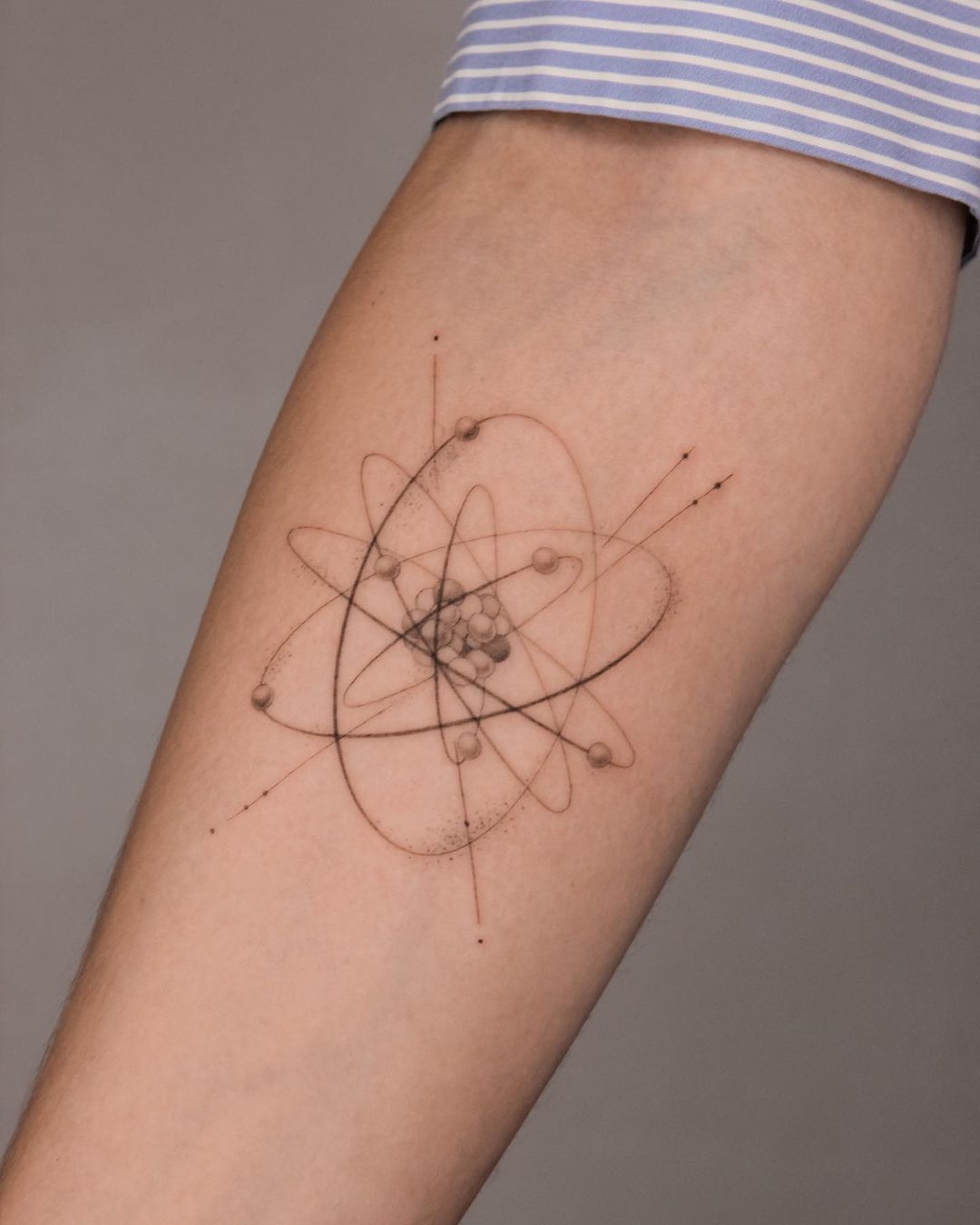 atom arm tattoo 