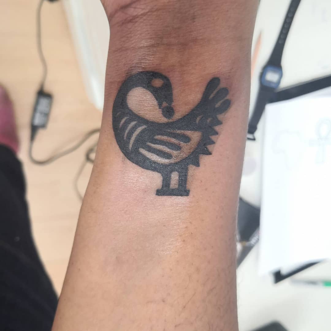Sankofa arm tattoo