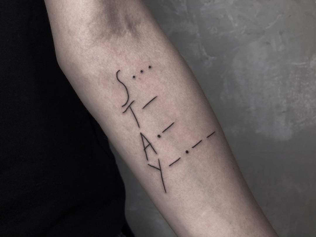 "stay" arm tattoo