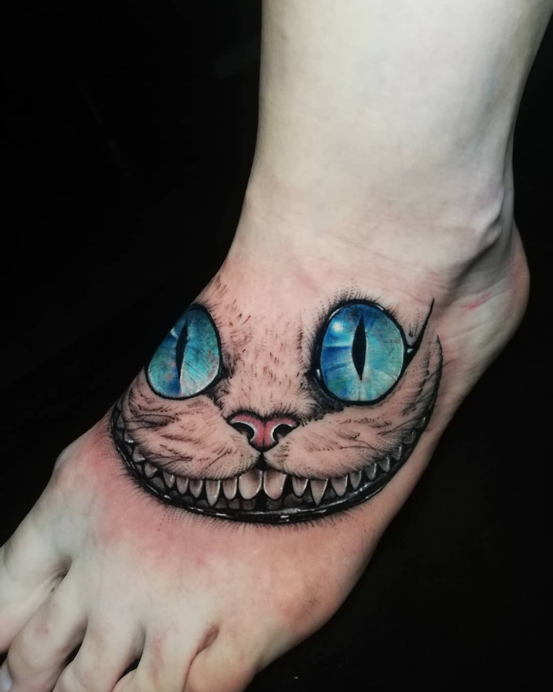 Cheshire foot tattoo