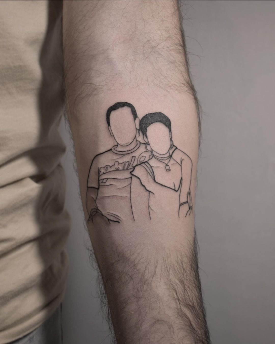 Faceless couple tattoo