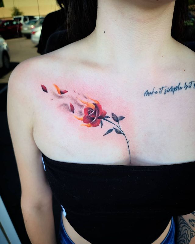 burning rose chest tattoo