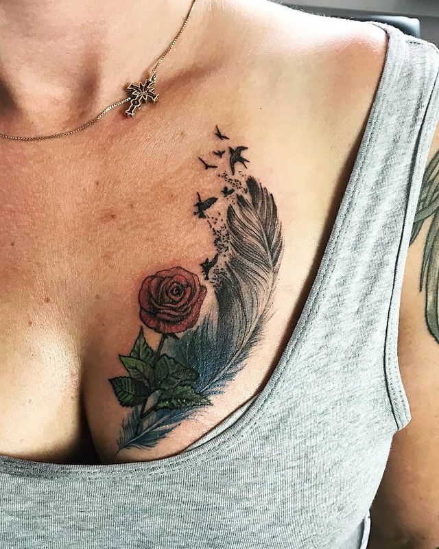 Feather rose chest tattoo